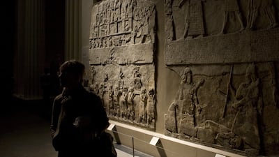 A visitor views Assyrian stone carvings at the British Museum in London, in 2009. Getty Images