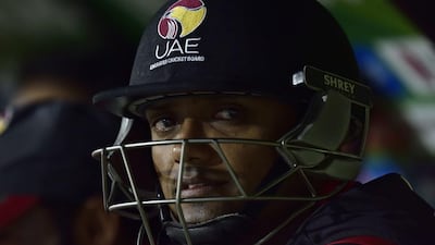 UAE's batsman Amjad Javed waits his turn to bat as he sits on the UAE bench during a Pool B Cricket World Cup match between South Africa and UAE (United Arab Emirates) at Wellington Regional Stadium in Wellington on March 12, 2015. AFP PHOTO / MARTY MELVILLE
