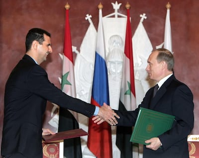 Vladimir Putin and Bashar Al Assad at the Kremlin in Moscow, 25 January 2005. AFP