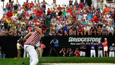 Keegan Bradley celebrates his par putt on the 18th at Firestone Country Club to secure the Bridgestone Invitational