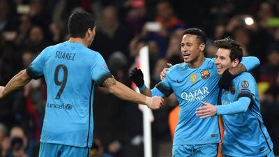 Lionel Messi celebrates with teammates Neymar and Luis Suarez after scoring Barcelona's first goal on Tuesday night. Tony O'Brien / Action Images / Reuters / February 23, 2016