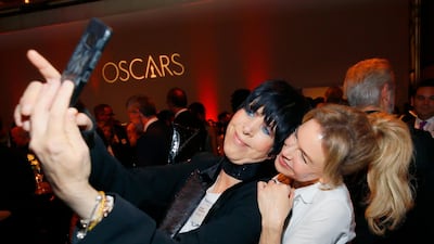 Diane Warren and Renee Zellweger take a selfie. AP