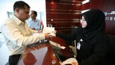 People obtain their ID cards at the Emirates Identity Authority registration centre in Al Barsha in Dubai.