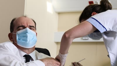 France's Prime Minister Jean Castex gets a Covid-19 vaccine. Foreign health workers were among those granted French citizenship for their services during the pandemic. AFP