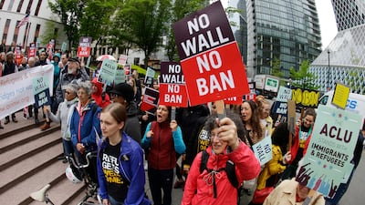 Protesters demonstrate against US president Donald Trump's revised travel ban outside a federal courthouse in Seattle on May 15, 2017. Ted S Warren / AP Photo