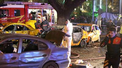 Police examine the site of a car bombing near Ankara’s Kizilay square, a key shopping and transport hub close to the city’s embassy area, on March 13, 2016. Adem Altan / AFP