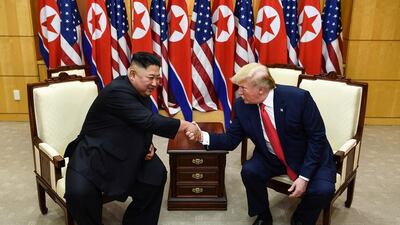 US President Donald Trump shakes hands with North Korean leader Kim Jong-un. AFP