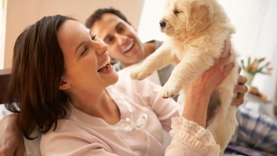 Many couples are choosing pets over children, without thinking of the potential consequences for their health. Getty.