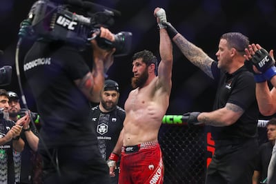 Magomed Ankalaev has his hand raised after his victory over Bogdan Guskov. Victor Besa / The National