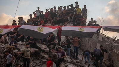 Displaced Palestinians gather to watch the match between Egypt and Argentina in Gaza city. EPA
