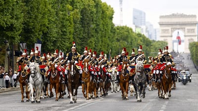 France's Republican Guard joins the celebrations on horseback. AFP