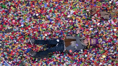 A reveller takes a selfie in the confetti during the new year celebration in New York’s Times Square. Mary Altaffer / AP Photo