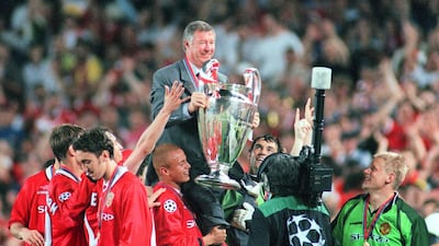 1999 - Lifts the Champions League trophy to complete the treble of the Premier League, FA Cup, and Champions League titles. Alexander Hassenstein / Getty Images