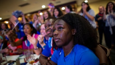 Ashleigh Patterson, 19, cries as she and others watch Sydney McLaughlin in the finals of the 400-meter hurdles at the Tokyo Olympics during a watch party in Mountainside, New Jersey.
