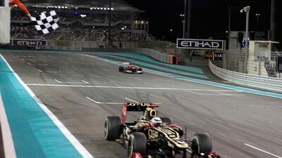 Kimi Raikkonen takes the chequered flag and wins the 2012 Abu Dhabi Grand Prix ahead of Fernando Alonso.