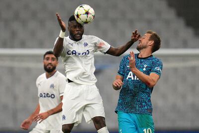 Marseille's Chancel Mbemba challenges Tottenham's Harry Kane. AP Photo