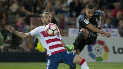 Real Madrid forward Lucas Vazquez, right, shoots. Sergio Camacho / AFP