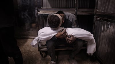 Bodies of 34 Palestinians are brought to Al Shifa Hospital after Israeli air strikes in various parts of the Gaza Strip on July 15