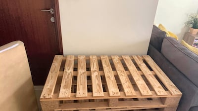 They set to work sourcing some recycled pallets to create a chair after being inspired by Pinterest and Instagram. Photo by Samantha Hall