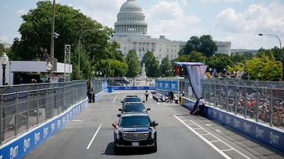 US President Donald Trump's motorcade on the track before the event. Bloomberg