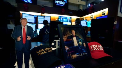 Merchandise featuring US president-elect Donald Trump on the floor of the New York Stock Exchange. Investors are on a wait-and-see approach as the returning US leader prepares to take office. AFP