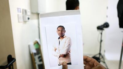 Kalpesh Patel from Gujarat shows off his newly printed portrait. Pawan Singh / The National