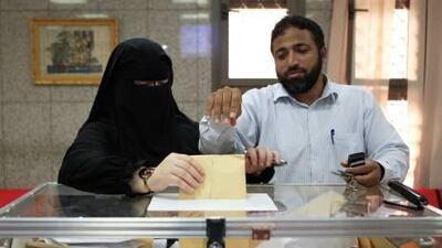 :El Sayed El Fayoumi and Marwa Ibrahim cast their votes for the first time outside their country yesterday at the Egyptian Embassy in Abu Dhabi.