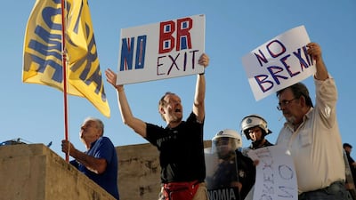 Above, demonstrators hold placards reading 'No Brexit' during a protest outside the parliament in Athens, Greece. Alkis Konstantinidis / Reuters