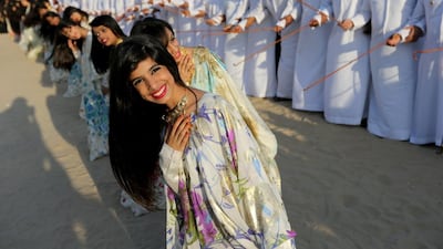 Emiratis perform a traditional Emirati dance during the Qasr al Hosn festival. Sammy Dallal / The National