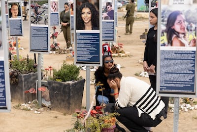 Photos of victims of the October 7 Hamas-led attacks, during Israel's annual memorial day observance, at the Nova Memorial Site. Getty Images