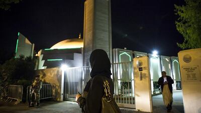 00:04 - Ms Mekhalfia heads home from the heavily guarded mosque during Ramadan.