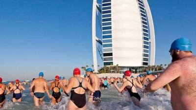 Participants start a charity swim around the Burj Al Arab.