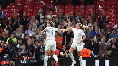 Ellen White, left, and Beth Mead celebrate at the end of England's victory over Austria. EPA