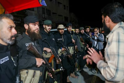 Syrian government forces stationed at the entrance of the mainly Druze district of Jaramana near Damascus. AFP