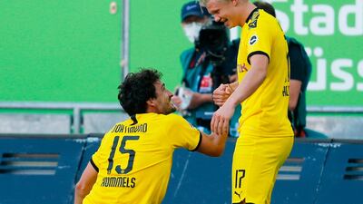 Erling Braut Haaland, right, is congratulated by Dortmund's German defender Mats Hummels. AFP