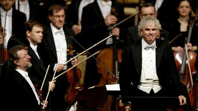 Simon Rattle conducts the Berlin Philharmonic Orchestra during a concert in Abu Dhabi, in November 2010. AFP