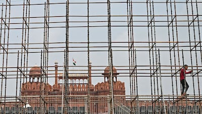 A worker secures scaffolding in front of the Red Fort in preparation for India’s 78th Independence Day celebrations in the walled city area of the capital, New Delhi. AFP