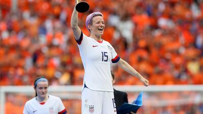 Megan Rapinoe, who scored the opening goal for the US, lifts the Fifa Women's World Cup. AP Photo