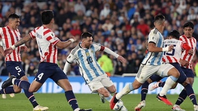 Argentina forward Lionel Messi surrounded by Paraguay players. EPA