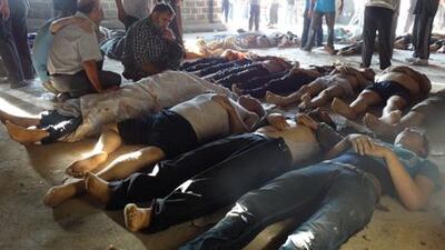 Relatives and activists inspect the bodies of people they say were killed by nerve gas in the Ghouta region, in the Duma neighbourhood of Damascus. /Mohamed al-Abdullah/Shaam News Network