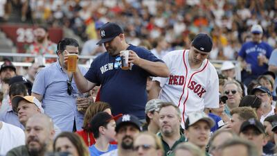 Baseball fans attend the first of a two-game series between the New York Yankees and the Boston Red Sox at London Stadium in Queen Elizabeth Olympic Park, east London. As Major League Baseball prepares to make history in London, New York Yankees manager Aaron Boone and Boston Red Sox coach Alex Cora are united in their desire to make the ground-breaking trip memorable on and off the field. AFP