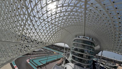 Ferrari driver Kimi Raikkonen drives under the Yas Viceroy hotel during the first practice session ahead of the Abu DhabiGrand Prix at Yas Marina Circuit. Andrej Isakovic / AFP Photo