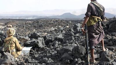 Militiamen loyal to Yemen's exiled government take up a position during fighting with Houthi rebels in Marib province on September 13, 2015. Stringer/Reuters