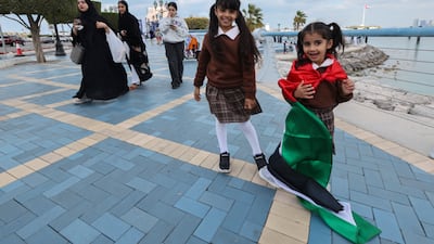 Spectators await the Day of Solidarity aerial parade over the Corniche in Abu Dhabi on Saturday, Janaury 17. Organised by the Ministry of Defence, the display featured elite pilots from the UAE Armed Forces, including the renowned Al Fursan aerobatic team. All images: Victor Besa / The National