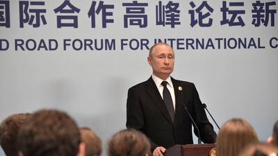 Russian President Vladimir Putin listens to questions during a news conference. Reuters