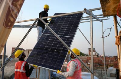 A rooftop ongrid solar panel system is fixed on a roof of a house in Allahabad, India, on October 14. AP
