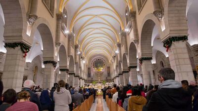 Archbishop Pierbattista Pizzaballa, the top Roman Catholic cleric in the Holy Land, heads a Christmas midnight mass at Saint Catherine's Church, in the Church of the Nativity, traditionally recognised by Christians to be the birthplace of Jesus Christ, in the West Bank city of Bethlehem. AFP