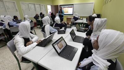 Grade 7 pupils at Umm Suqeim Model School in an English class use high-technology equipment as part of the Sheikh Mohammed bin Rashid Smart Learning Programme. Jeffrey E Biteng / The National