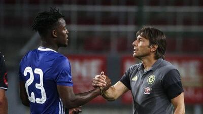 Antonio Konte shake hands with Michy Batshuayi after the match. Srdjan Stevanovic / Getty Images