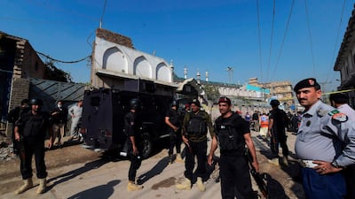 Security personnel secure a street after a blast in a religious school in Peshawar. AFP